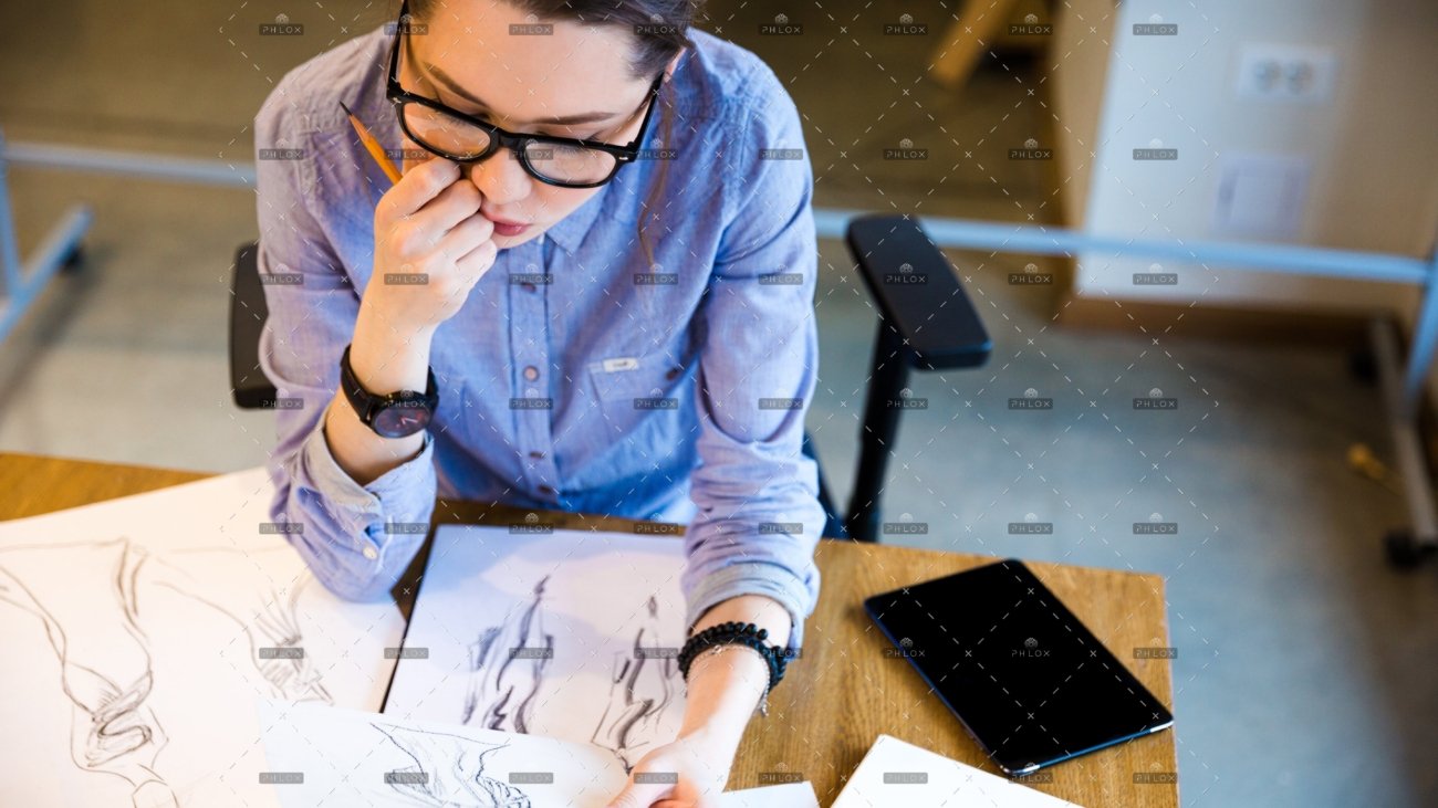 demo-attachment-168-pensive-woman-fashion-designer-sitting-and-PHGZYEM